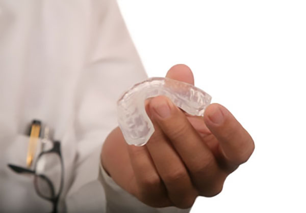 Get A Mouthguard From Your General Dentistry Practice To Prevent Tooth Wear